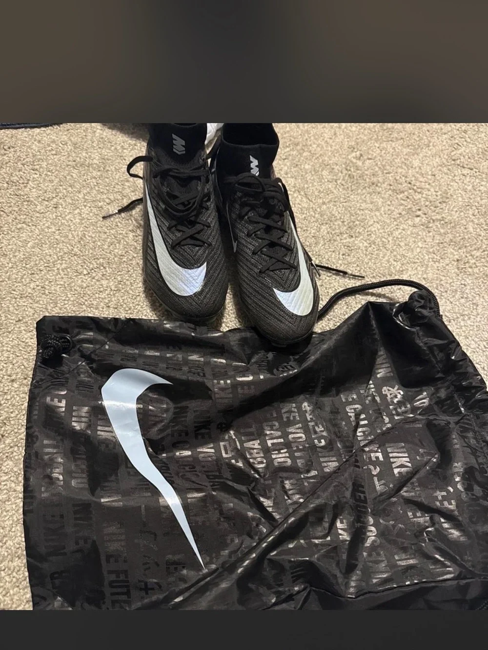 Nike woman’s Gen 4 black and light blue soccer cleats size 6